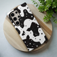 Cow Print & Stars Phone Case – Trendy, Cosmic, and Built for Protection