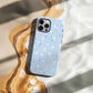 Pastel Floral Sky Phone Case – Soft Blue Background with Tiny Flowers