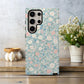 Pastel Meadow Floral Case – Soft Blue Background with Delicate Wildflowers