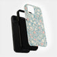 Pastel Meadow Floral Case – Soft Blue Background with Delicate Wildflowers