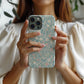 Pastel Meadow Floral Case – Soft Blue Background with Delicate Wildflowers